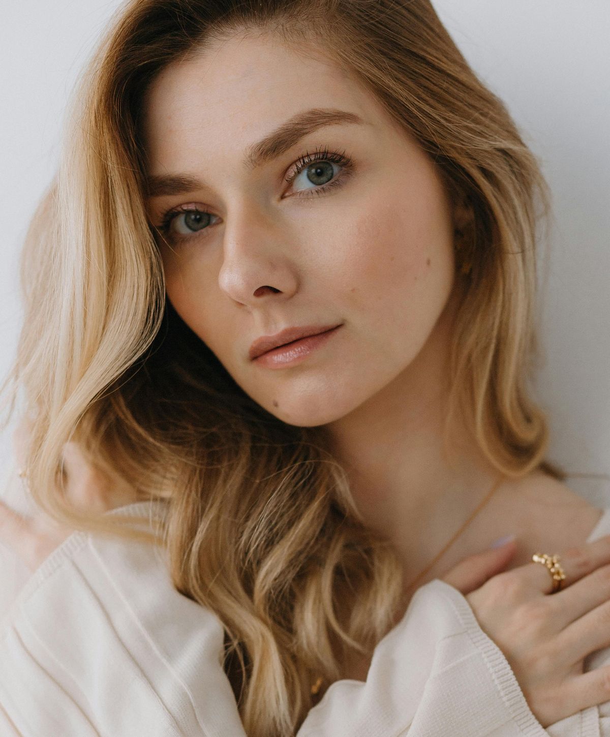 Portrait of a woman with long, wavy hair.