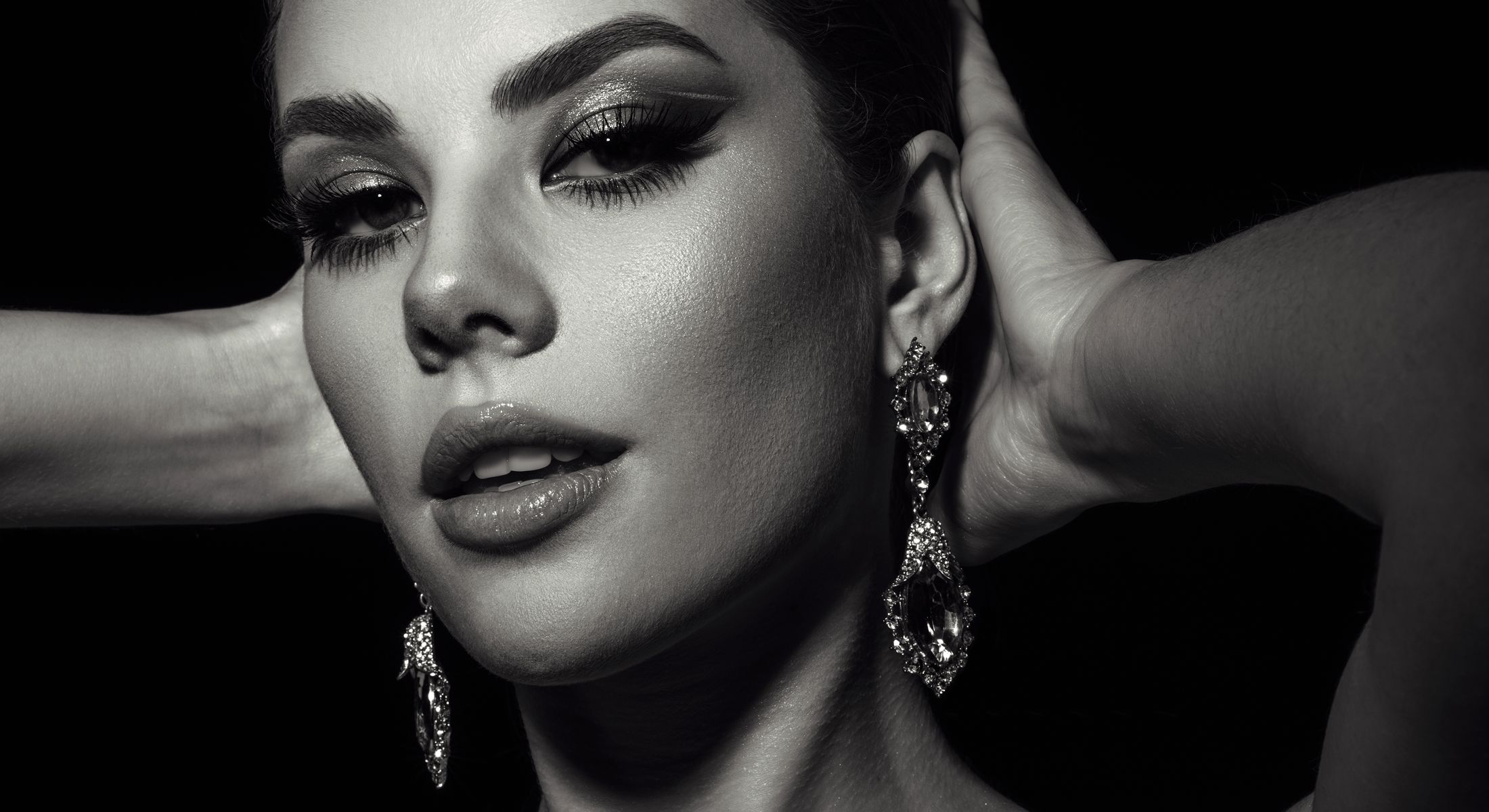 Black and white portrait of a glamorous woman.